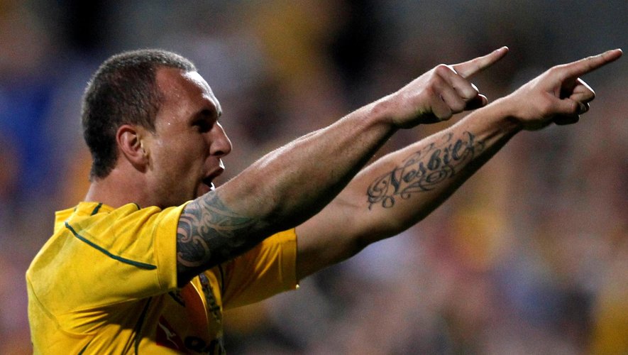 Australia's Quade Cooper celebrates after scoring a try during their Rugby Union test match against England in Perth