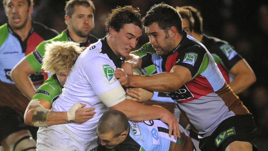 RUGBY Harlequins' Mike Brown and Nick Easter (right) tackle Toulouse's Louis Picamoles in a Heineken Cup match on Dec 9