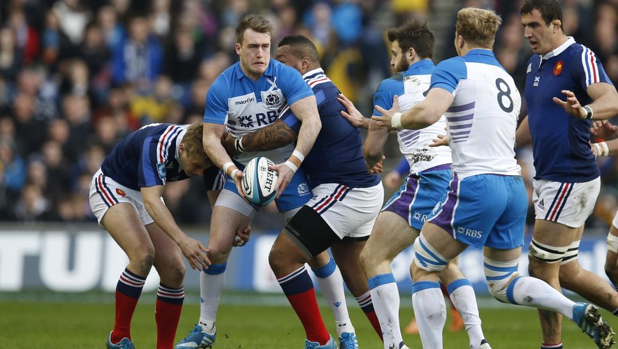 Scotland's Stuart Hogg (2nd L) passes as he is tackled by France's Mathieu Bastareaud and Jules Plisson (L) during their six nations rugby union match at Murrayfield Stadium (Reuters)