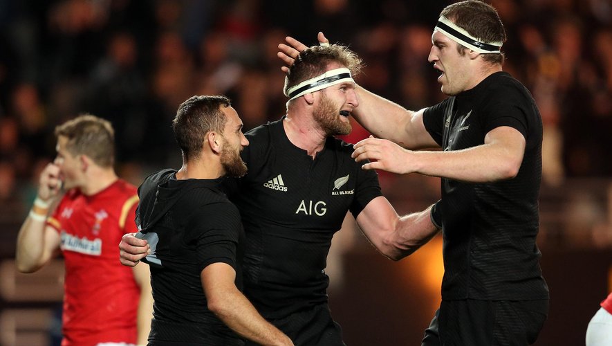 New Zealand All Blacks Kieran Read (C) celebrates his try with teammates Aaron Cruden (L) and Brodie Retallick (R) during the rugby Test match between the New Zealand All Blacks and Wales at Eden Park in Auckland on June 11.