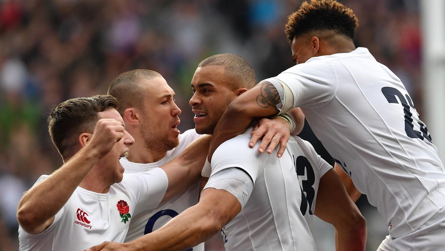 England's centre Jonathan Joseph (2R) celebrates after scoring his team's first try during the Six Nations international rugby union match between England and Scotland at Twickenham stadium in south west London on March 11, 2017
