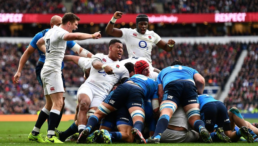 England players Owen Farrell, Nathan Hughes and Maro Itoje of England celebrate the opening try against Italy
