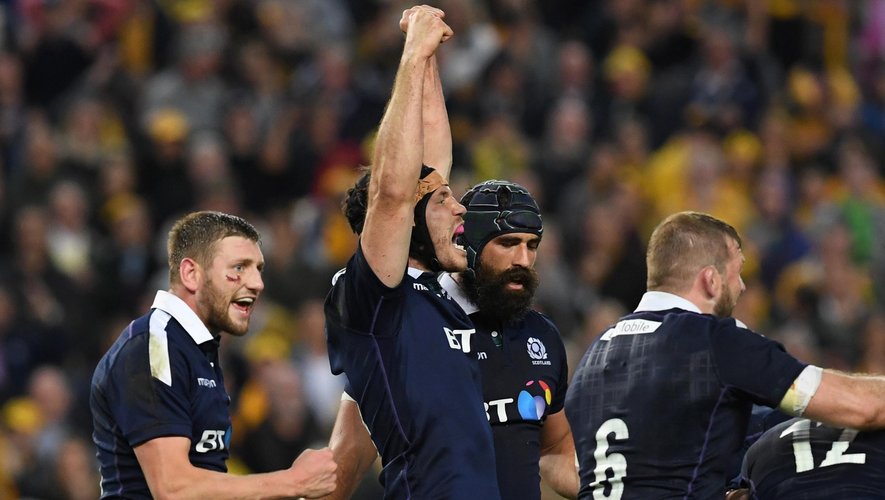 Scotland's Tim Swinson (2nd L) celebrates beating Australia in their rugby union Test match in Sydney on June 17, 2017
